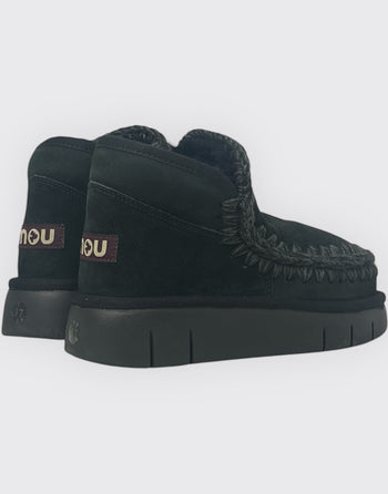Quattro Stagioni black suede Eskimo bounce sneakers with knitted trim and platform sole.