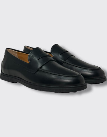 Quattro Stagioni black leather penny loafers with rubber sole.