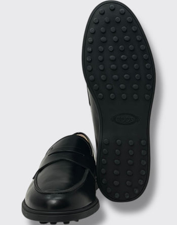 Quattro Stagioni black leather penny loafers with iconic rubber pebble sole. Classic slip-on style.
