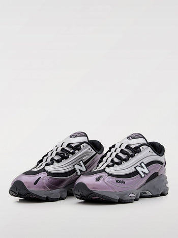 Quattro Stagioni Lifestyle 1000 women's sneakers in metallic lavender and silver with black accents and a chunky grey sole.