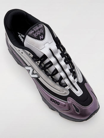 Quattro Stagioni Lifestyle 1000 sneakers in silver, black, and purple metallic finish. Mesh and synthetic materials.