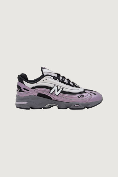 Quattro Stagioni Lifestyle 1000 women's sneakers in lilac and grey with white and black accents.