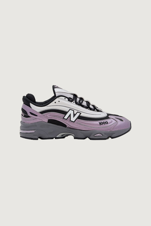 Quattro Stagioni Lifestyle 1000 women's sneakers in lilac and grey with white and black accents.
