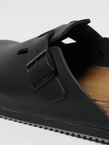 Quattro Stagioni Boston clogs in black leather with adjustable buckle and cork footbed.
