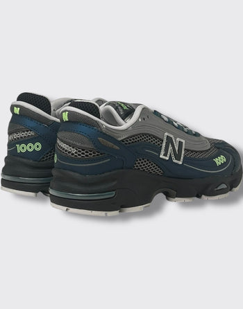 Quattro Stagioni Lifestyle 1000 navy and grey mesh sneakers with neon green accents and chunky black sole.
