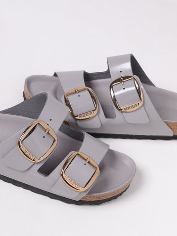 Quattro Stagioni Arizona big buckle shine grey patent leather sandals with gold hardware.