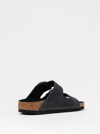 Quattro Stagioni black nubuck leather Arizona Big Buckle sandals with adjustable straps and cork sole.