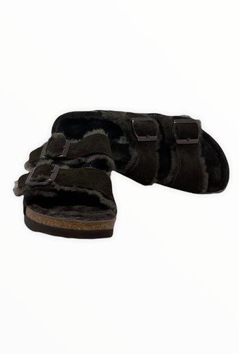 Quattro Stagioni black suede Arizona shearling sandals with adjustable buckles and cozy shearling lining.
