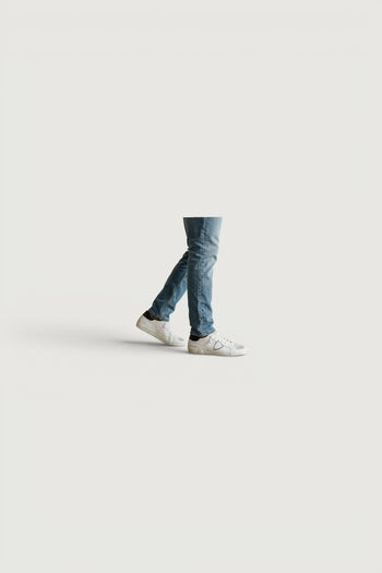 Quattro Stagioni Paris low man white leather sneakers with black heel detail and grey suede toe.