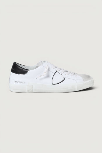 Quattro Stagioni Paris low man white leather sneakers with black heel tab and grey suede toe.